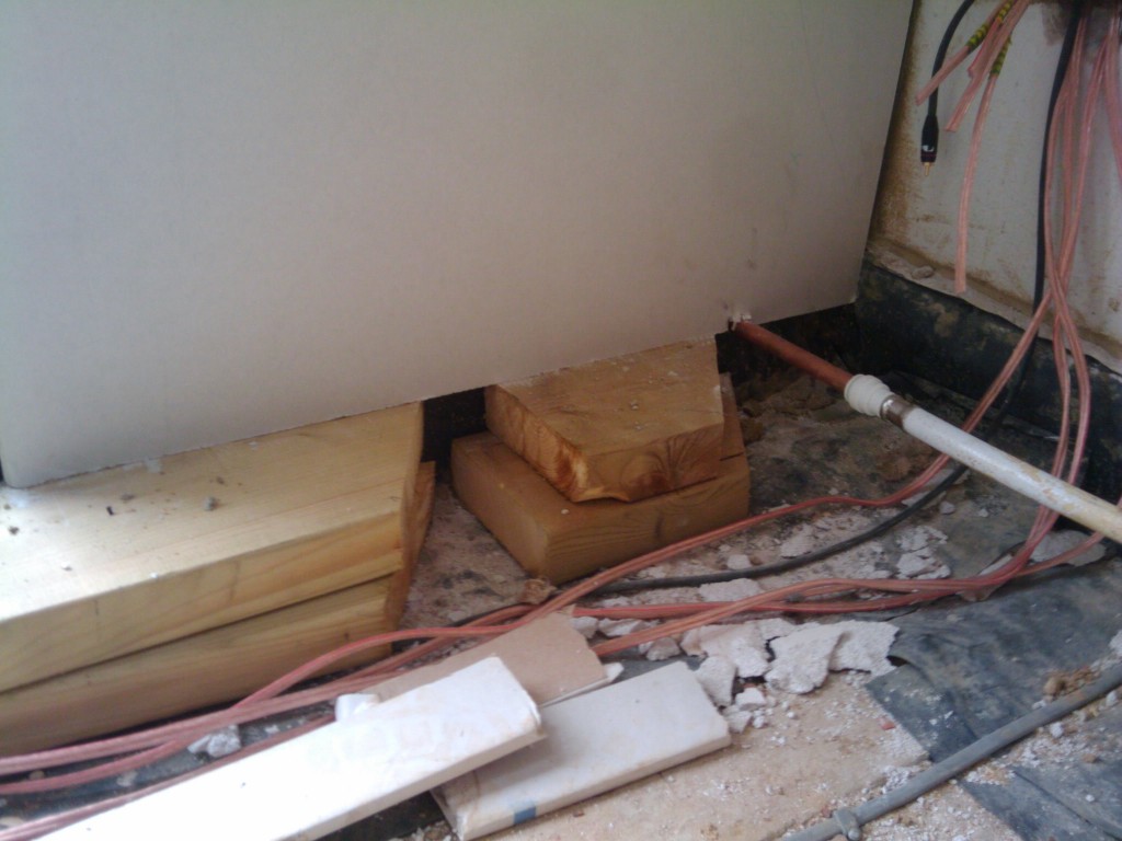 Various items keeping the plasterboard in place
