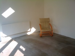 A chair and a small carpet - the first furnishings