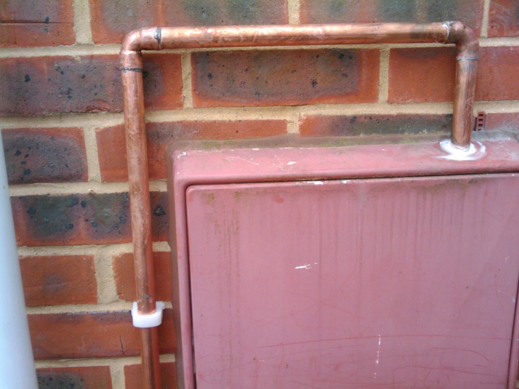 Pipe coming out of the gas meter box